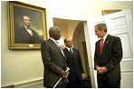  President George W. Bush welcomes President Daniel arap Moi of Kenya and Prime Minister Meles Zenawi of Ethiopia to the Oval Office Dec. 5, 2002. These leaders, who are friends and allies of America, have joined in global war on terror. President Bush stressed the global reach of the war and noted that if the terrorists could strike in Kenya, they could strike in Ethiopia or anywhere.