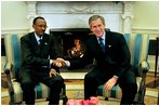President George W. Bush meets with President Paul Kagame of Rwanda in the Oval Office Tuesday, March 4, 2003. 