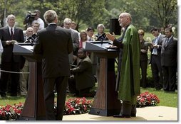 President George W. Bush and Hamid Karzai of Afghanistan hold a joint press conference in the Rose Garden Tuesday, June 15, 2004.  White House photo by Paul Morse.