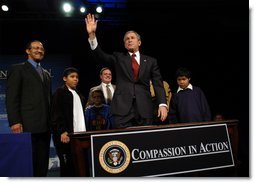 President George W. Bush waves to the audience after signing an executive order for equal protection of the laws for faith-based and community organizations in Philadelphia, Pa., Thursday, Dec. 12. White House photo by Eric Draper.