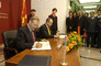 Secretary Rumsfeld and Macedonian Minister of Defense Vlado Buckovsk sign an agreement in Skopje.