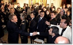 President George W. Bush greets enthusiastic audience members after discussing his immigration policy in the East Room Wednesday, Jan. 7, 2004. White House photo by Paul Morse.