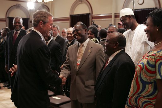 After signing into law the African Growth and Opportunity Act (AGOA) Acceleration Act of 2004, President George W. Bush meets with ceremony attendees in the Dwight D. Eisenhower Executive Office Building Tuesday, July 13, 2004. White House photo by Paul Morse.