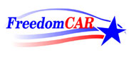 FreedomCAR logo of text with blue star; red and blue streamers on white backgroun