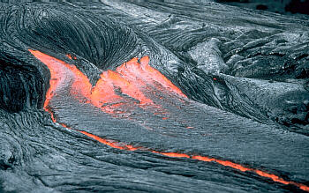Close view of lava moving across the ground, Kilauea Volcano, Hawai`i