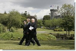 President George W. Bush walks with Prime Minister of Ireland Bertie Ahern, right, and President of the European Commission Romano Prodi on the way to their joint press conference at the Dromoland Castle in Shannon, Ireland, Saturday, June 26, 2004. White House photo by Eric Draper.