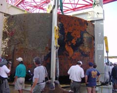 NOAA photo of USS Monitor turret after it was brought onboard the Derrick Barge Wotan on August 5, 2002.