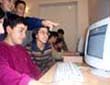 Azerbaijani students around a computer
