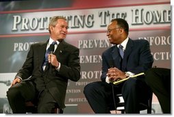 President George W. Bush thanks Larry Thompson, former Deputy Attorney General of the United States, for his service during a conversation on the USA Patriot Act in Buffalo, N.Y., Tuesday, April 20, 2004. "The Patriot Act needs to be renewed and the Patriot Act needs to be enhanced," said the President of the act that is due to expire next year. White House photo by Eric Draper.