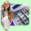 photograph of two students with a calculator in the background.