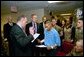 President George W. Bush attends the U.S. Citizenship Ceremony for Marine Corps Lance Cpl. O.J. Santamaria of Daly City, Calif., at the National Naval Medical Center in Bethesda, Md., Friday, April 11, 2003. White House photo by Eric Draper.