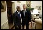 President George W. Bush welcomes United Nations Secretary General Kofi Annan to the Oval Office Tuesday, Feb. 3, 2004. After their meeting, they addressed the press.  White House photo by Paul Morse