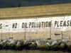 Coastal break with words painted on wall "No Oil Pollution Please"