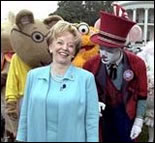 Accompanied by all sorts of story book characters, Lynne Cheney the host of the 2003 White House Easter Egg Roll, addresses the media on the South Lawn Monday, April 21, 2003. 