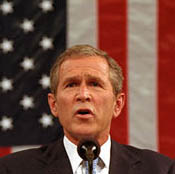 President Bush at podium, U.S. flag as backdrop