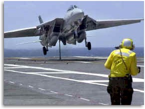 A Tomcat lands onboard a carrier.