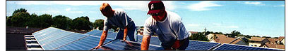 Photo of researchers examining photovoltaic panels.