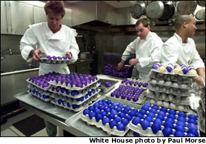  White House chefs arrange some of the thousands of dyed eggs in preparation for the annual Easter Egg Roll on the South Lawn of the White House on April 1, 2002.