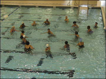 Seniors participating in water aerobic.