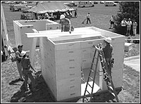Construction workers building a tornado safe room