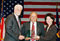 Secretary of Labor Elaine L. Chao (right) presents Labor Hall of Fame awards to Douglas McCarron (left), International President of the United Brotherhood of Carpenters and Joiners of America and Bob Terreri (center), NJ State Council of United Brotherhood of Carpenters at the 2004 Labor Hall of Fame Induction in Washington on Oct. 13.