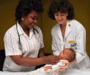 Nurse and Physician caring for a baby