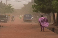 The city of Bamako, Mali, during a dust event. The red tint of the dust is the classic color of windborne soils originating from the Sahara and Sahel.
