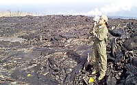 Volunteer conducts a VLF (very-low frequency) survey over a lava tube
