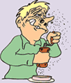 Image of a man grinding pepper about to sneeze.