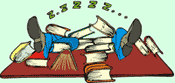Image of a student sleeping with feet up on a desk and a pile of books