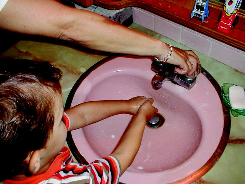photo - Boy washing his hands