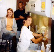 Picture of three students working in the lab.