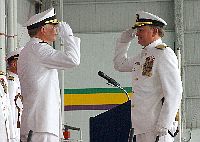 Chief of Navy Reserve and Commander, Naval Reserve Force, Vice Adm. John G. Cotton, left, grants Rear Adm. Daniel L. Kloeppel permission to go ashore.