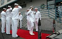 Capt. Gary S. Almeida is piped aboard at the change of command ceremony for Naval Coastal Warfare Squadron Three Four.