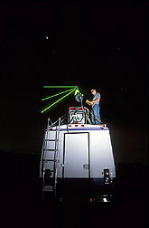 Photo: Michael Cloos, a University of Iowa student, adjusts the LiDAR laser. Link to photo information