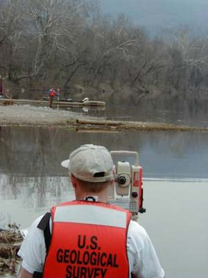 [Photo of USGS personnel measuring slope]
