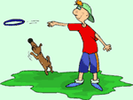 Image of a boy tossing a ring and his dog fetching it.