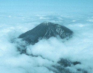 aerial photo showing profile of Mount St. Helens taken May 13, 1980.  Photo shows dramatic inflation of north flank in this profile view