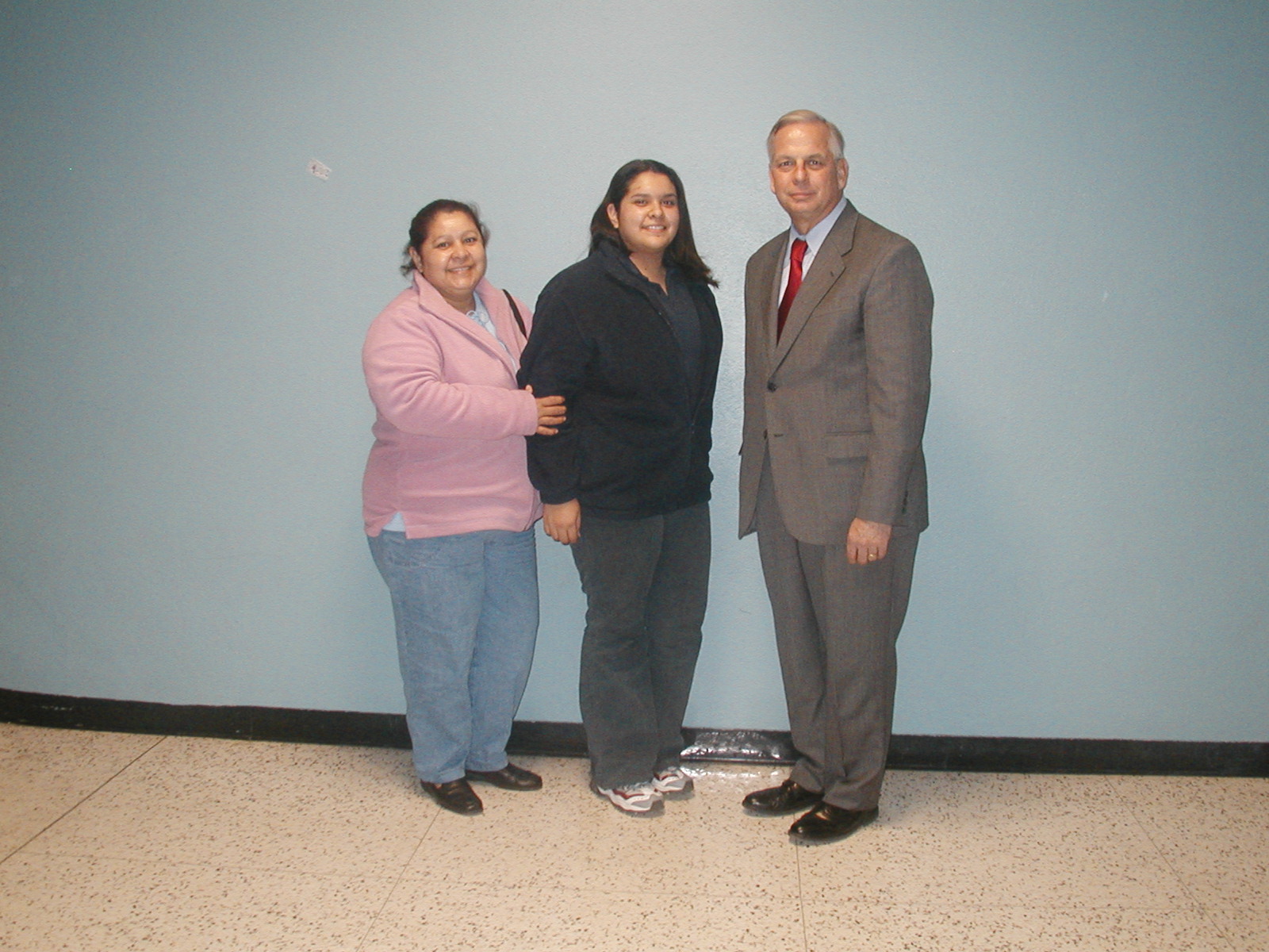 Faviola Flores, scholarship winner, and her mother with Congressman Green