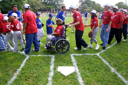 T-Ball teams from East Brunswick New Jersey Babe Ruth Buddy Ball League Sluggers in red and the Waynesboro Little League Challenger Division Sand Gnats in blue from Waynesboro, Virginia congratulate each other after playing Sunday September 22, 2002 on the South Lawn of the White House. White House photo by Paul Morse.