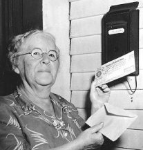 picture of Ida May Fuller holding check