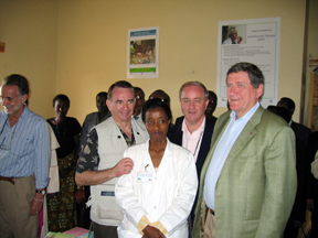 Secretary Thompson and Ambassadors Tobias and Holbrooke with hospital doctor.
