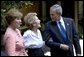 President George W. Bush and Mrs. Bush visit with Nancy Reagan outside the former First Lady's residence in Bel Air, Calif., Thursday, Aug. 12, 2004. White House photo by Eric Draper.