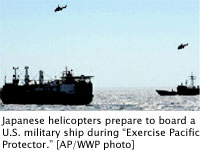 Japanese helicopters prepare to board a U.S. military ship during Exercise Pacific Protector. AP/WWP photo
