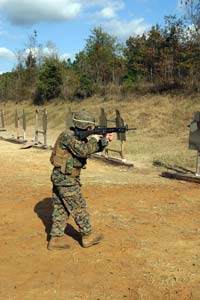 Cpl. Ryan Clay, a Wilkesboro, N.C., native and a squad leader for 3rd Platoon, Fox Company, BLT 2/8, fires on the move during the first level of the Enhanced Marksmanship Program at Fort A.P. Hill, Va. Photo by:Sgt. Roman Yurek