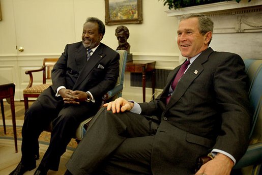 President George W. Bush and President Ismail Omar Guelleh of Djibouti greet the press during a meeting in the Oval Office Jan. 21, 2003. White House photo by Paul Morse.