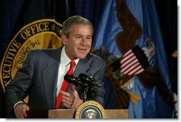 President George W. Bush talks with the employees of National Capital Flag Company in Alexandria. Va., about his Growth and Jobs Package, Thursday, Jan. 9, 2003. "This is a plan to encourage growth, focusing on jobs. And the Council of Economic Advisors has predicted that these proposals will create 2.1 million new jobs over the next three years. That's good for the American people. It's good for our economy, " President Bush said after his tour of the company. White House photo by Paul Morse.