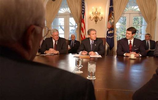 President George W. Bush signs the Temporary Extended Unemployment Compensation Act of 2002 in the Cabinet Room, Tuesday, Jan 7, 2003. Seated with the President are Sen. Bill Frist, right, Senate Majority Leader, and Congressman Dennis Hastert, left, Speaker of the House. The bill extends a federal program to provide 13 weeks of benefits for the unemployed who have exhausted their 26 weeks of state unemployment. White House photo by Tina Hager.