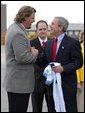 President George W. Bush greets Jason Matthews of the Tennessee Titans NFL team after arriving in Nashville, Tenn., May 27, 2004. White House photo by Paul Morse.