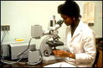 Woman Looking Through Microscope